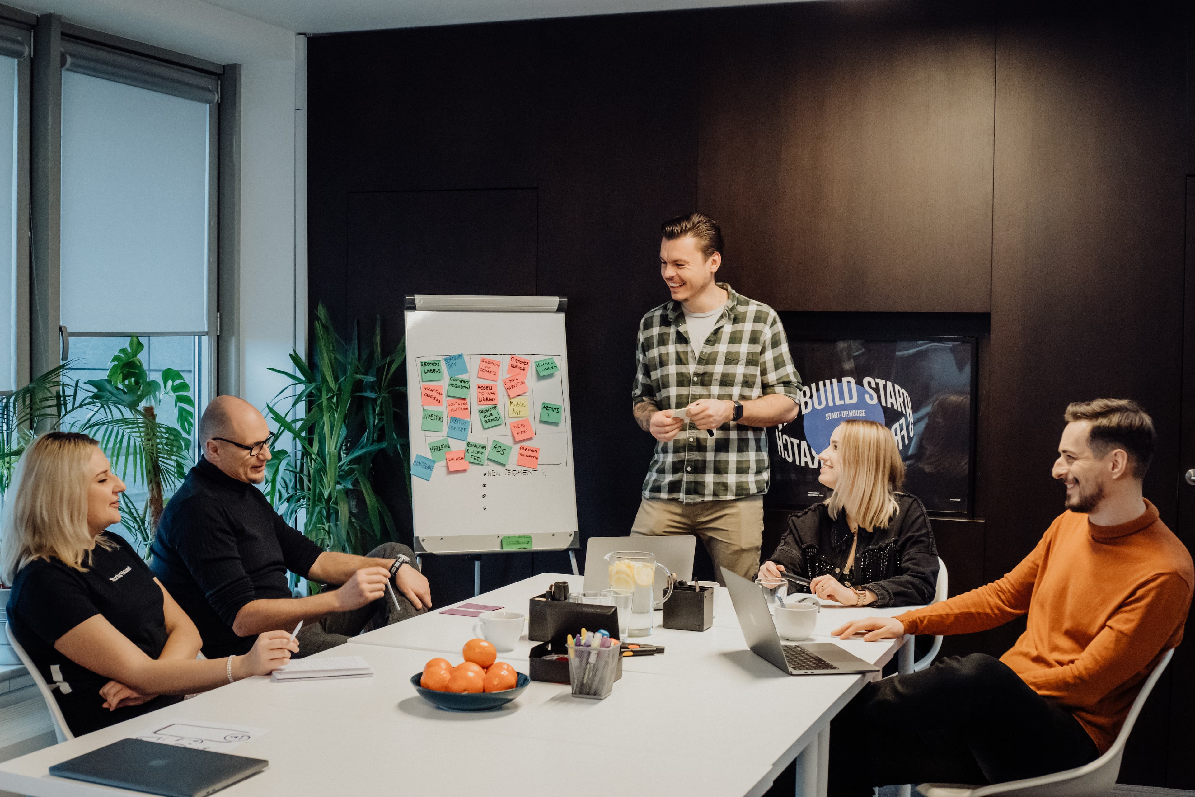 Startup team working on a product prototype to save costs